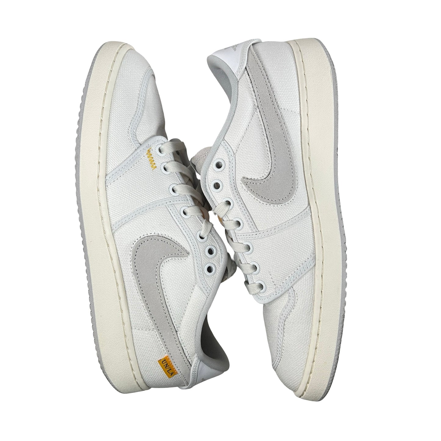 DO8912 101 Jordan 1 Retro AJKO Low SP Unión Lona Blanca