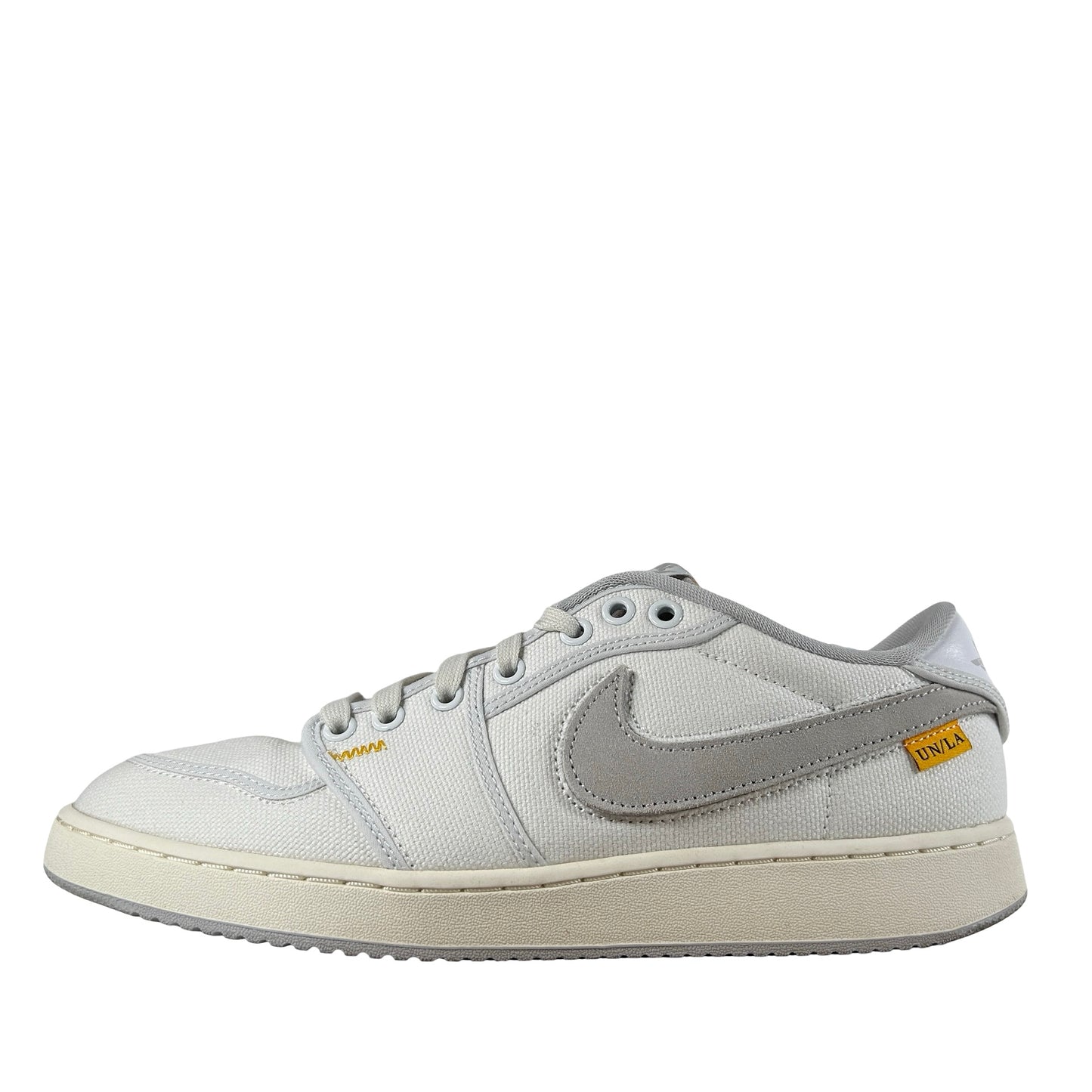 DO8912 101 Jordan 1 Retro AJKO Low SP Unión Lona Blanca