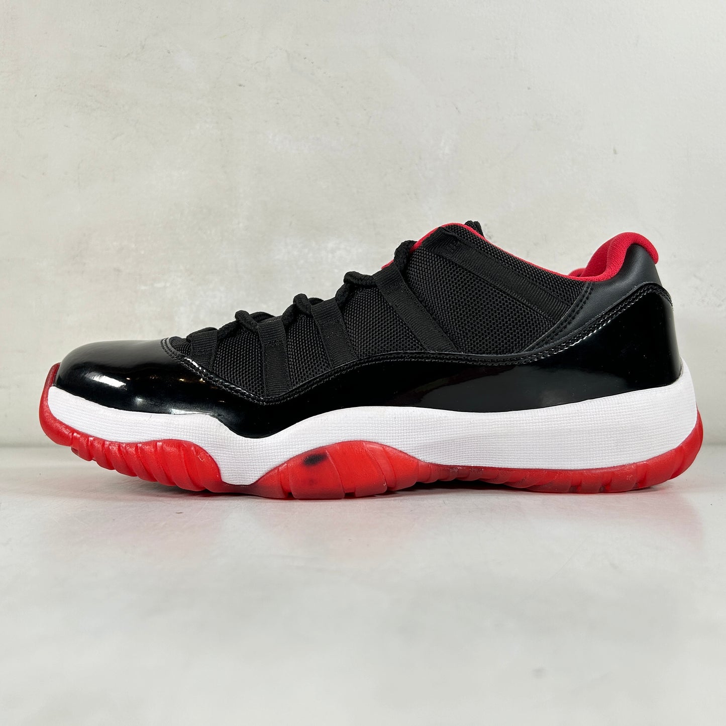 528895 012 Jordan 11 Retro Low Bred [CONDITIONAL] - 10.5 (Ink Stain On Left Foot)